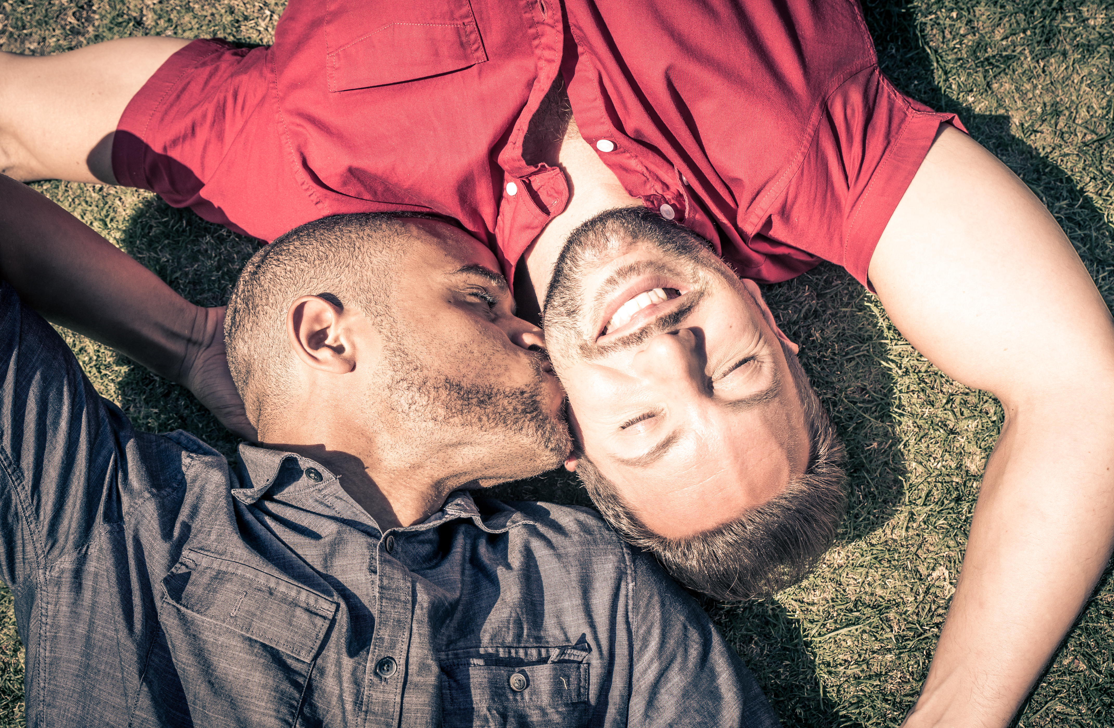 couple laying on ground